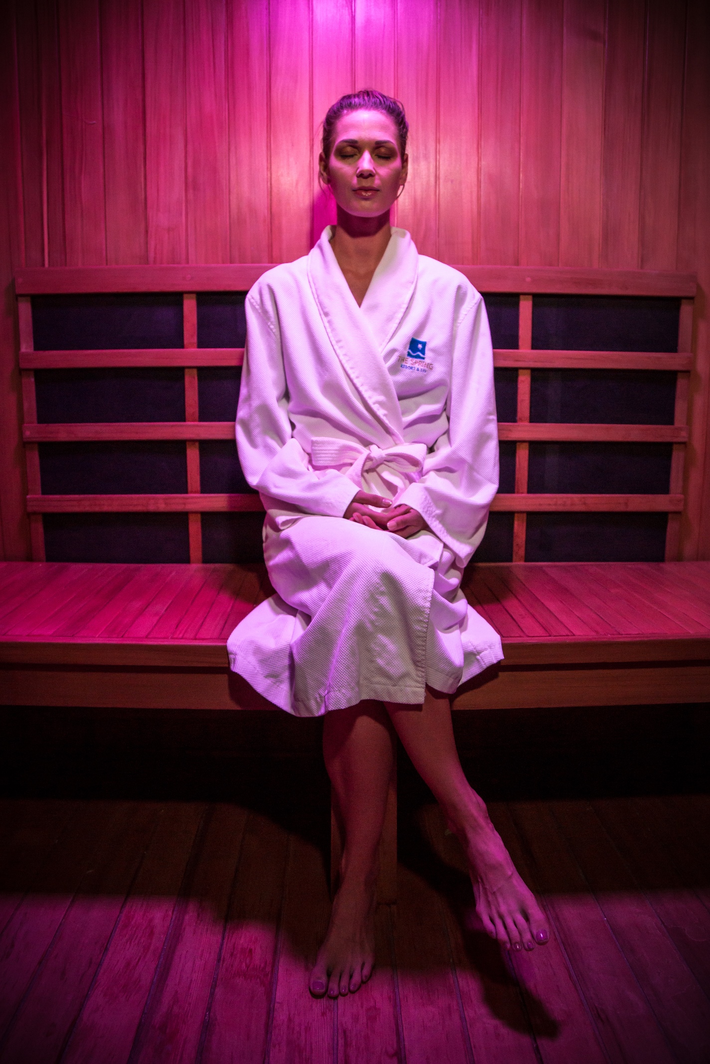 Guest relaxing in the infrared sauna with Chroma color light therapy