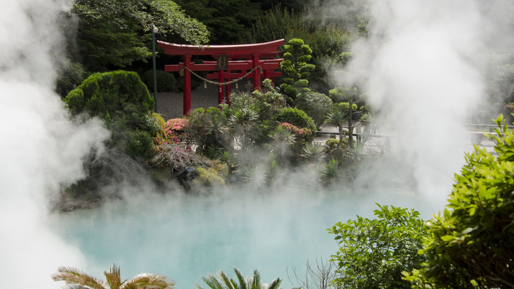 hot springs around the globe, steam rising